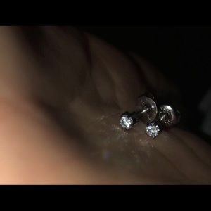 two pairs of sterling silver earrings.